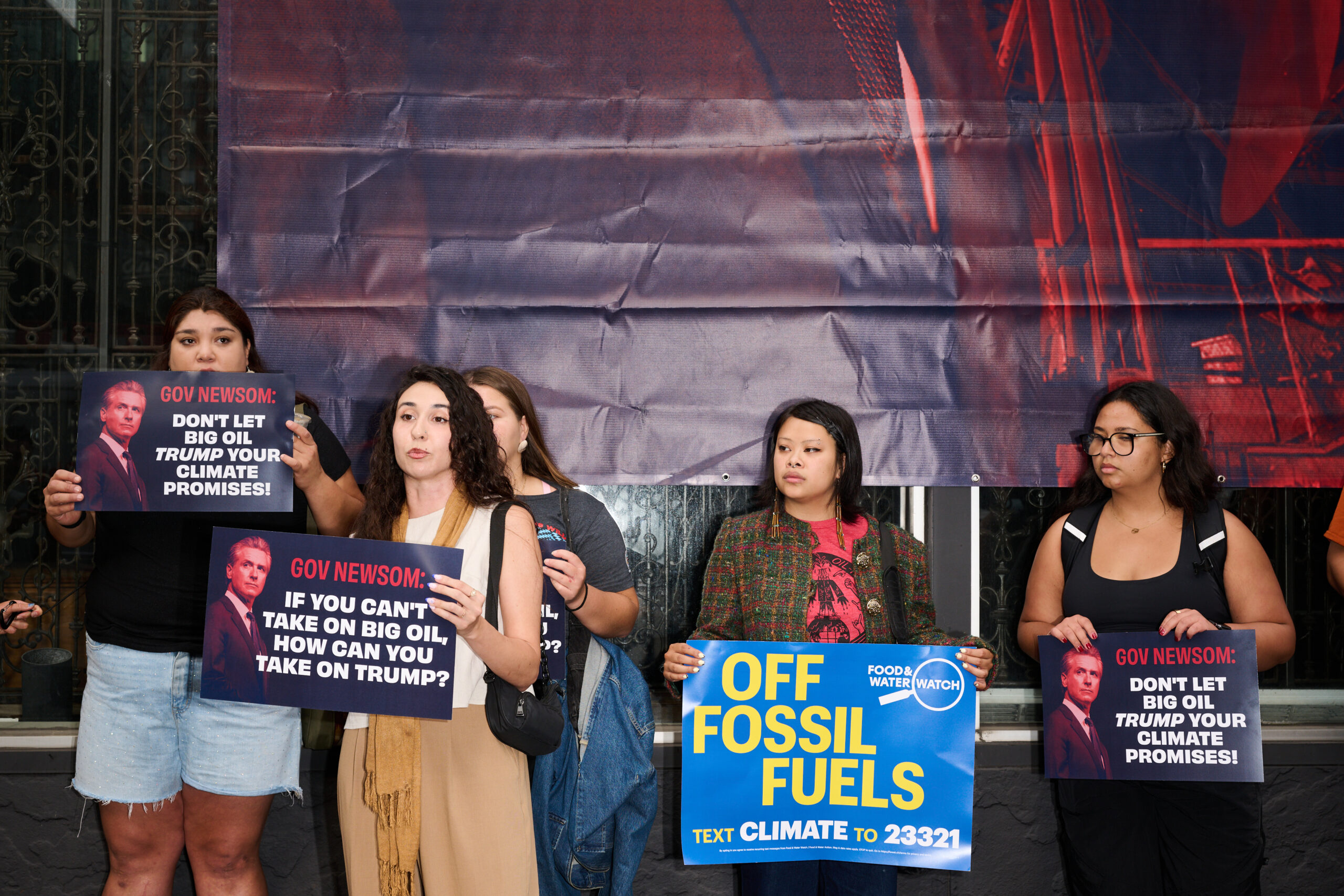 Over 40 groups call out Newsom for backsliding on climate promises, banner dropped in New York City